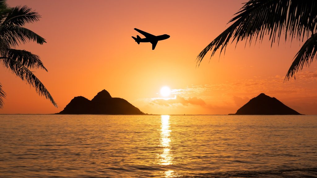 Plane Flying Over Hawaii Sunset Sunrise Istock 1478467229.jpg