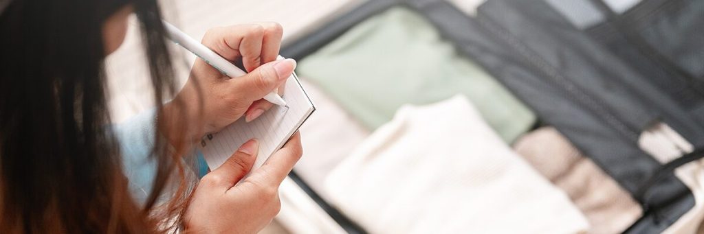 Woman Using Packing List Header Image 1200x400.jpg