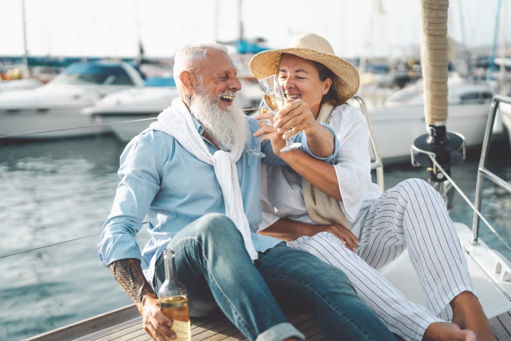 Senior Couple Toasting Champagne On Sailboat Vacat 2023 11 27 05 09 04 Utc Scaled.jpg