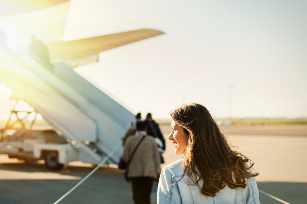 Woman Boarding Plane Outside.jpg